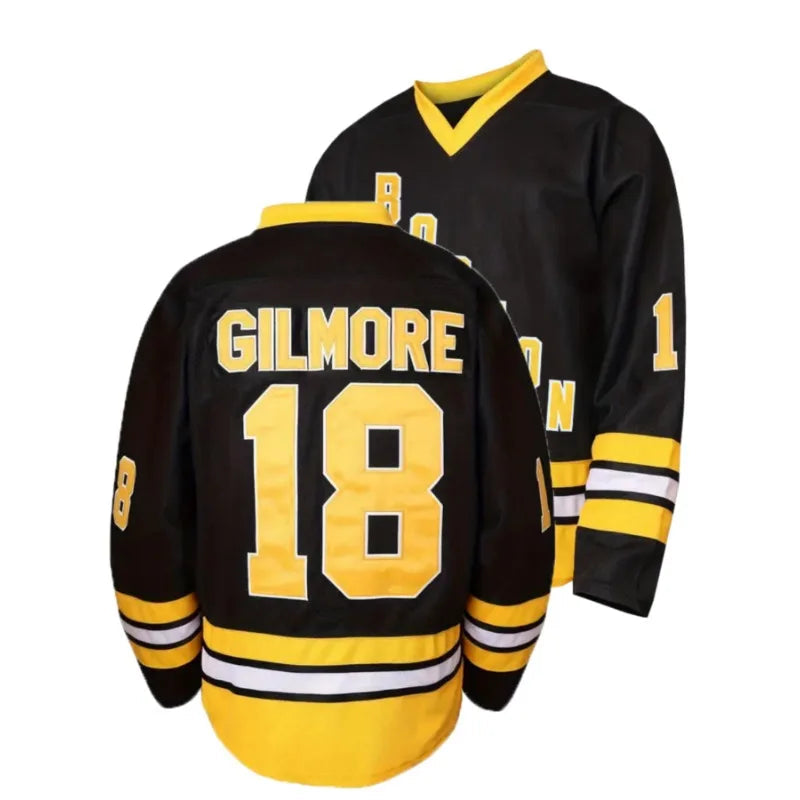 Black hockey jersey with yellow lettering and numbering on a white background