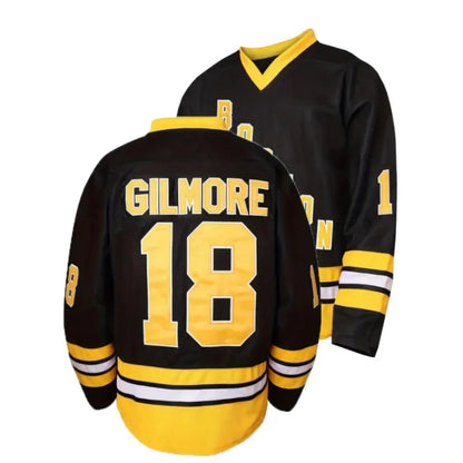 Black hockey jersey with yellow lettering and numbering on a white background